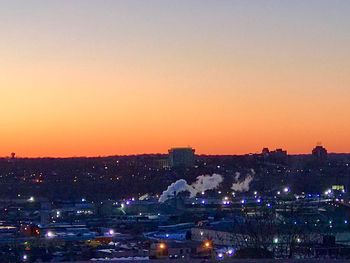 High angle view of illuminated buildings against sky during sunset