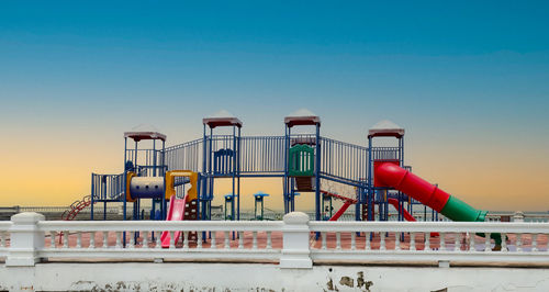 Low angle view of built structure against clear blue sky