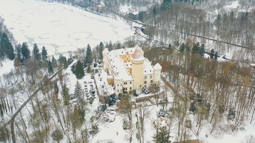 High angle view of trees by building during winter