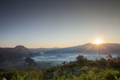 Scenic view of landscape against sky during sunset