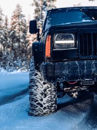 Close-up of vintage car on snow