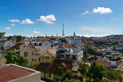 Buildings in town against sky