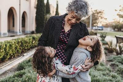 Close up lifestyle image of grandmother and grandchildren laughing