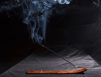 Close-up of fire hydrant against black background