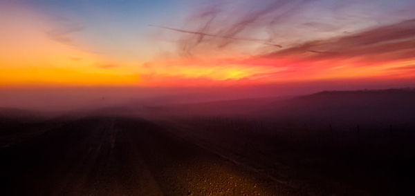 Scenic view of landscape against sky during sunset