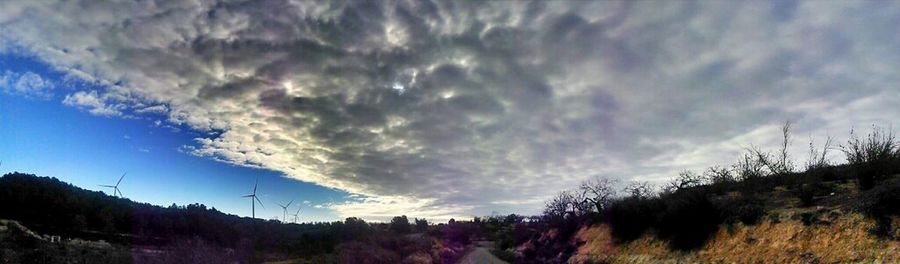 Scenic view of landscape against cloudy sky