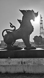 Low angle view of angel statue against sky