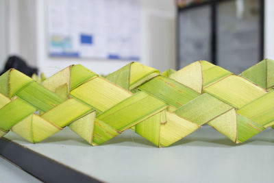 Close-up of braided leaves on table