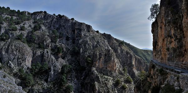 Low angle view of rock formations against sky