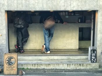 Low section of man and woman standing on steps