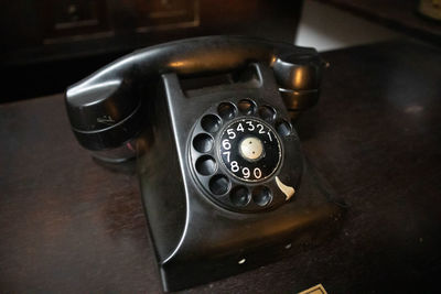 High angle view of telephone on table