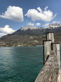 Scenic view of sea and mountains against sky