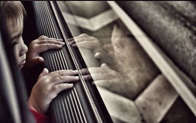 Close-up of man playing piano