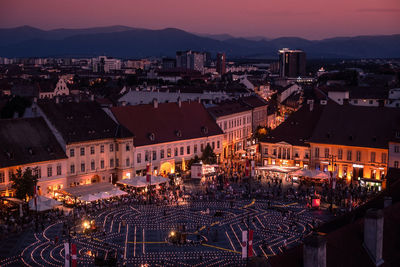 High angle view of illuminated buildings in city at night