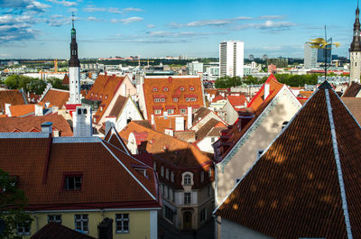 Buildings in city against sky