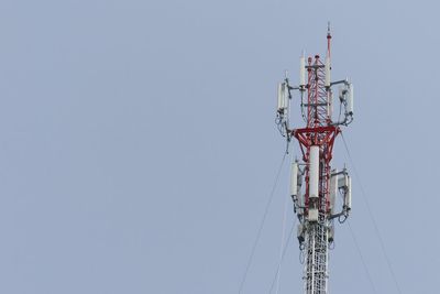 Low angle view of communications tower against clear sky