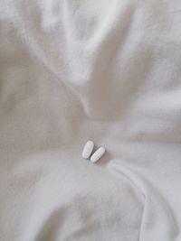 Close-up of pills on bed