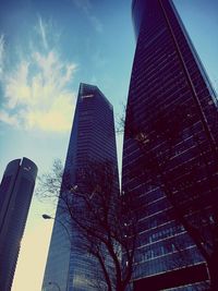 Low angle view of modern buildings against sky