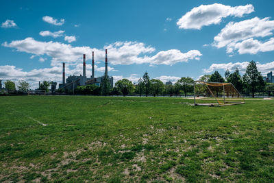 Built structure on field against sky