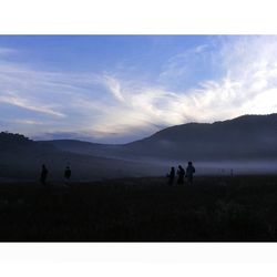 Scenic view of landscape against cloudy sky