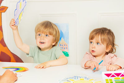 Cute girl playing with toys at home