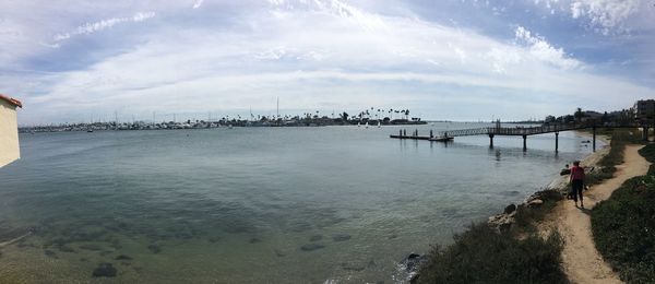 Panoramic view of bay against sky