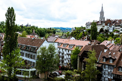 Buildings in town against sky