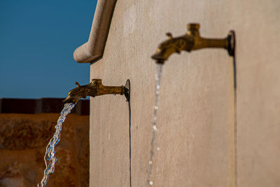 Close-up of water pipe against wall