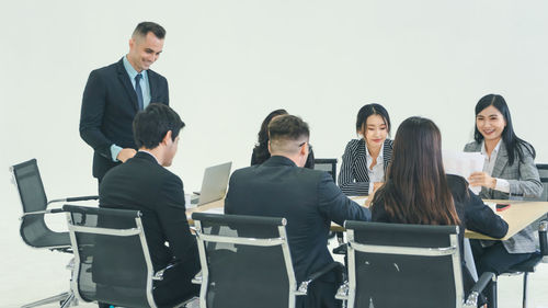 Group of people sitting on chair