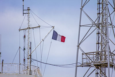 Low angle view of flag against sky