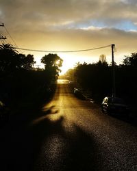 Car on road at sunset