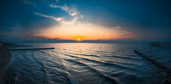 Scenic view of sea against sky during sunset