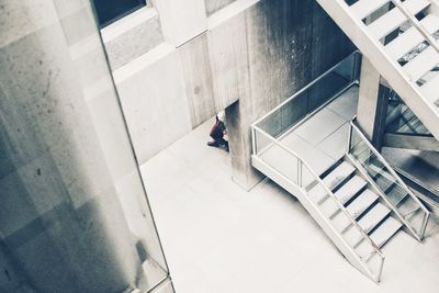 High angle view of people on staircase in building