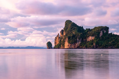 Scenic view of sea and mountains against sky