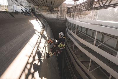 Long shot of a man working with rope access