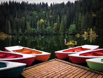 Colorful wooden boats on a lake in autumn