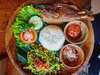 Directly above view of fresh meal served in plate on table