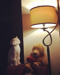 Close-up of a cat sitting on wall at home