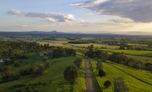 Scenic view of agricultural landscape against sky