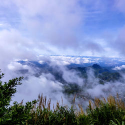 Scenic view of waterfall against sky