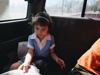 Girl traveling in car