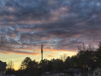 Low angle view of cloudy sky at sunset