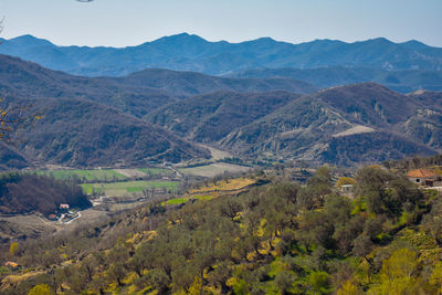Scenic view of landscape and mountains against sky