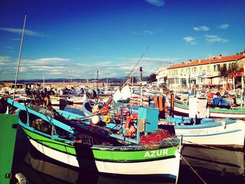 Boats moored at harbor