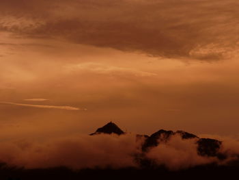 Scenic view of dramatic sky over landscape