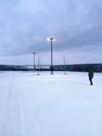 View of snow covered landscape against sky