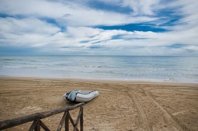 Scenic view of sea against cloudy sky