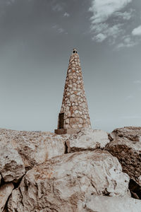 Low angle view of statue against sky