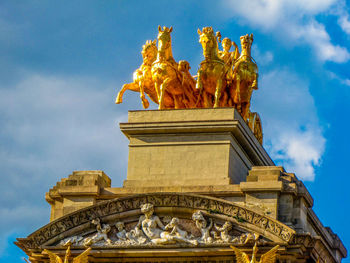 Low angle view of statue against cloudy sky