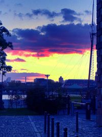 Scenic view of river against sky at sunset